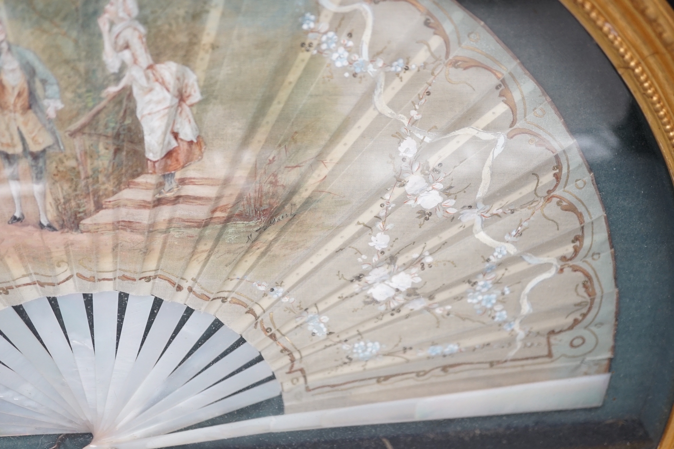 A framed Victorian figuratively painted fan with mother of pearl guards